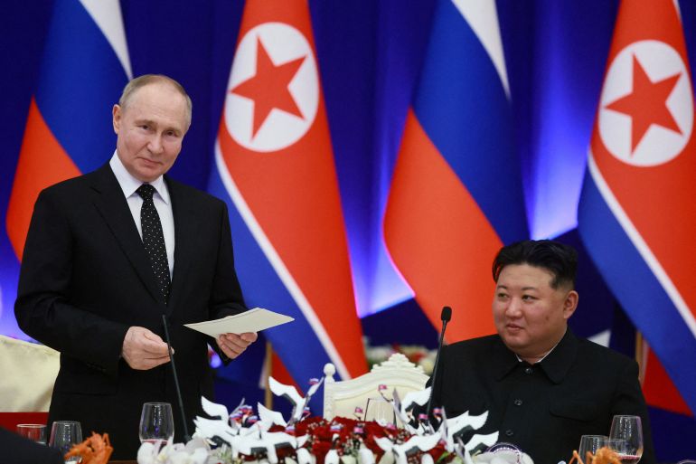 Russia's President Vladimir Putin and North Korea's leader Kim Jong Un attend a state reception in Pyongyang, North Korea, in June 2024